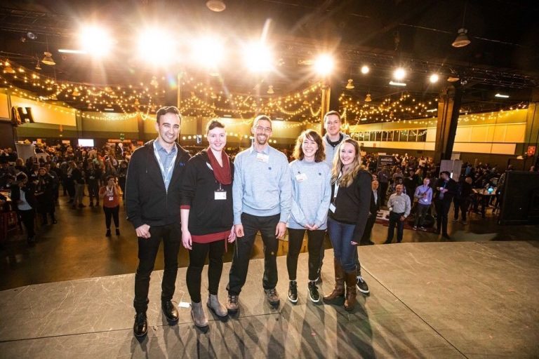 A photo of Kyle Nishiyama, Mikata Health CEO and co-founder (far left), and Meaghan Nolan, MIkata’s chief operating officer and co-founder (third from right), with Mikata team at launch party.