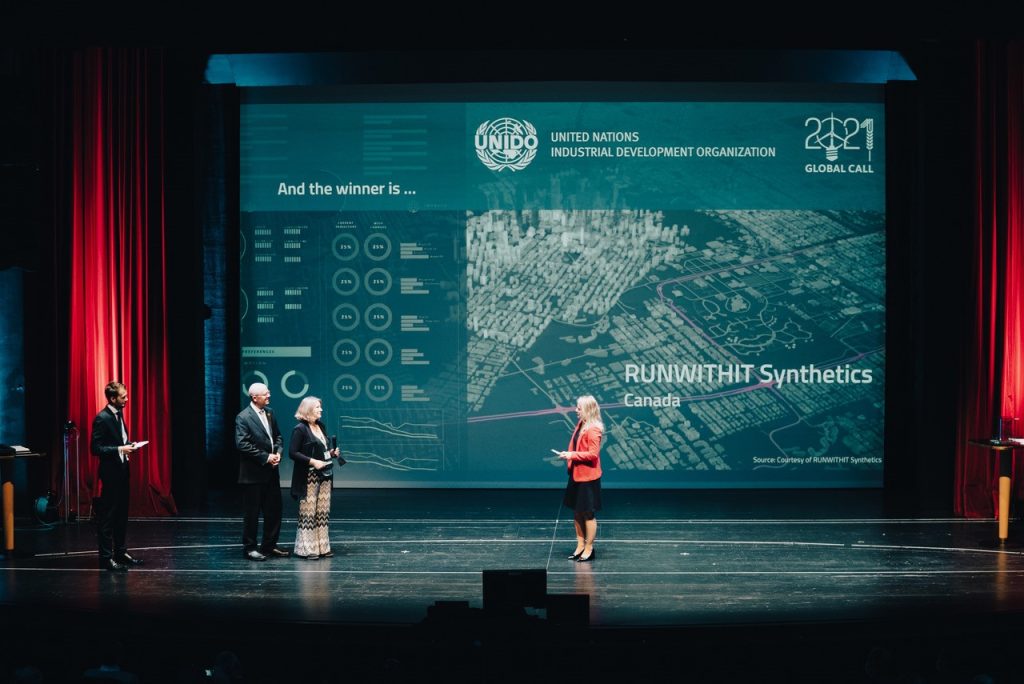 A photo of Myrna and Dean Bittner on stage at the UNIDO award ceremony